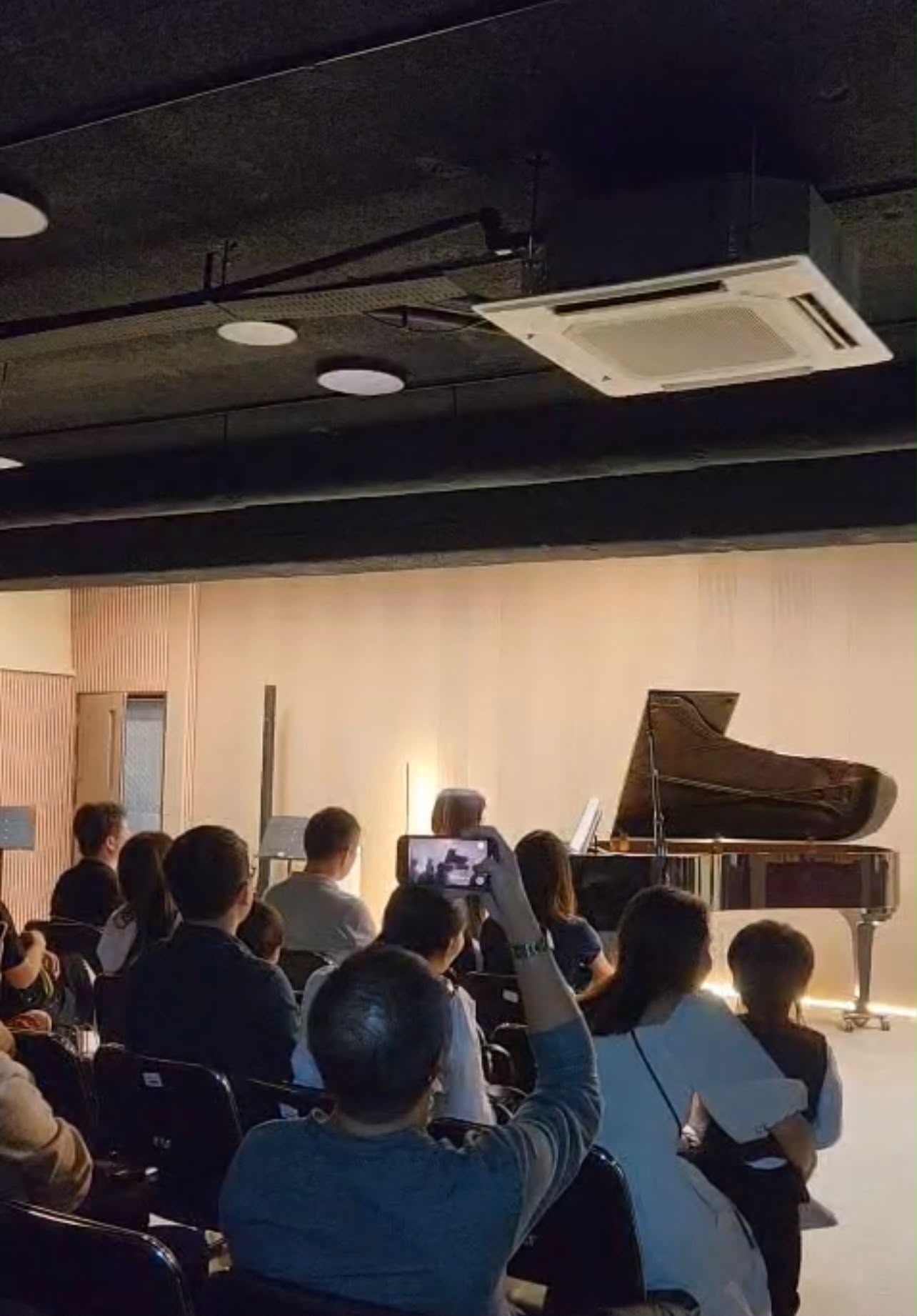 Two students performing a piano duet