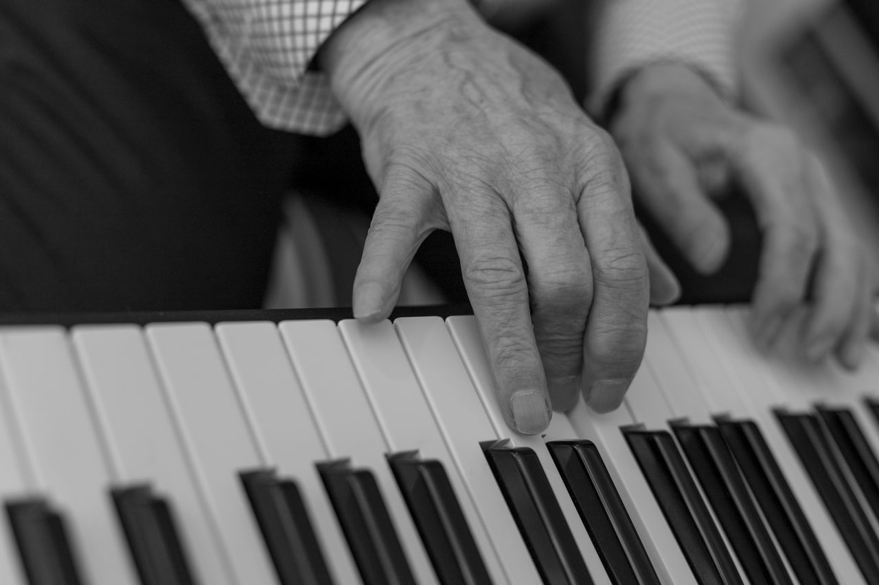 Adult student enjoying a Golden Melodies piano lesson